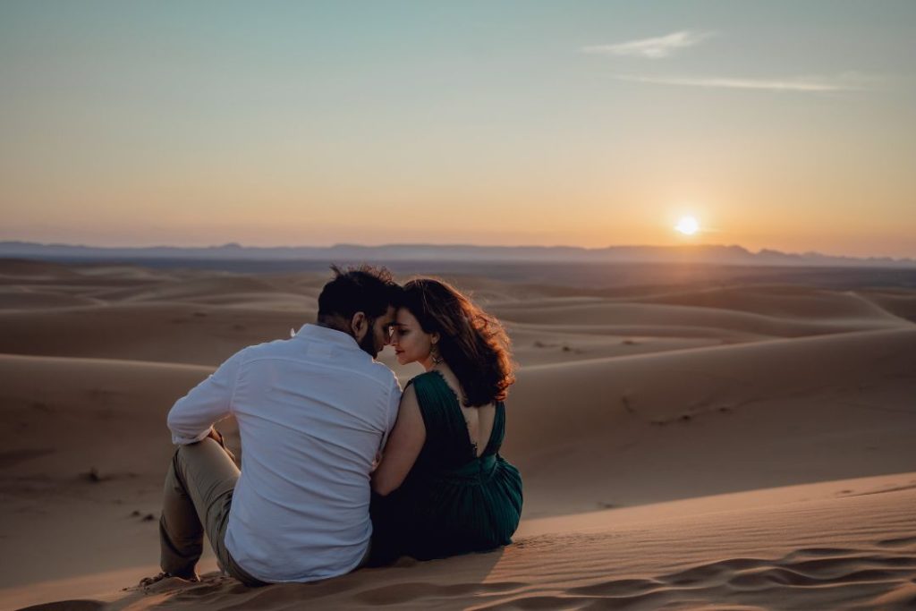 couple in high dune of our Marrakech to Fes desert tour
