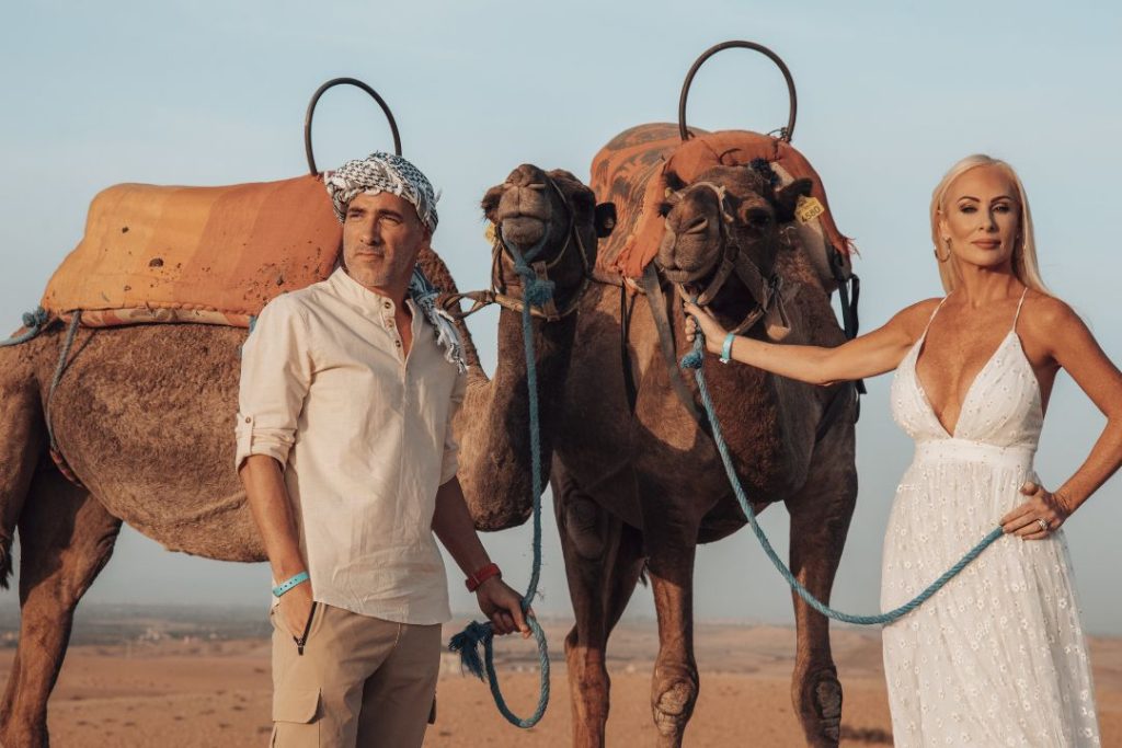 couple with camel of Marrakech to Fes desert tours